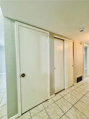 a bathroom with a shower and a glass door