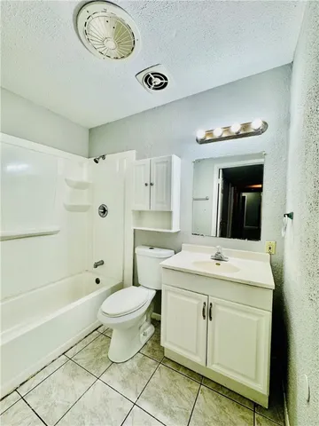 a spacious bathroom with a sink toilet and shower