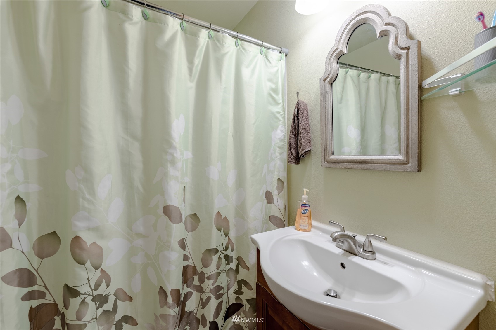 14202 Mima Road Southwest Olympia, WA 98512 - Photo 20 of 40 a bathroom with a sink and mirror with shower
