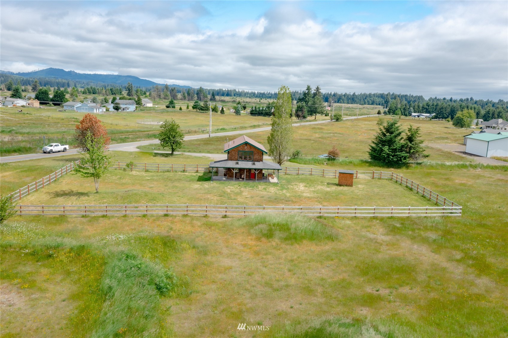 14202 Mima Road Southwest Olympia, WA 98512 - Photo 2 of 40 a view of a lake with a mountain