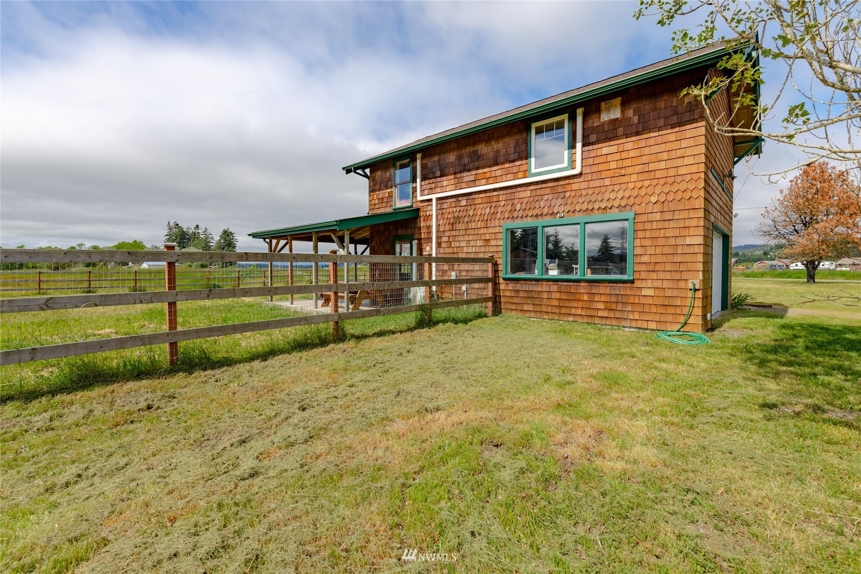 14202 Mima Road Southwest Olympia, WA 98512 - Photo 24 of 40 a view of a house with a backyard