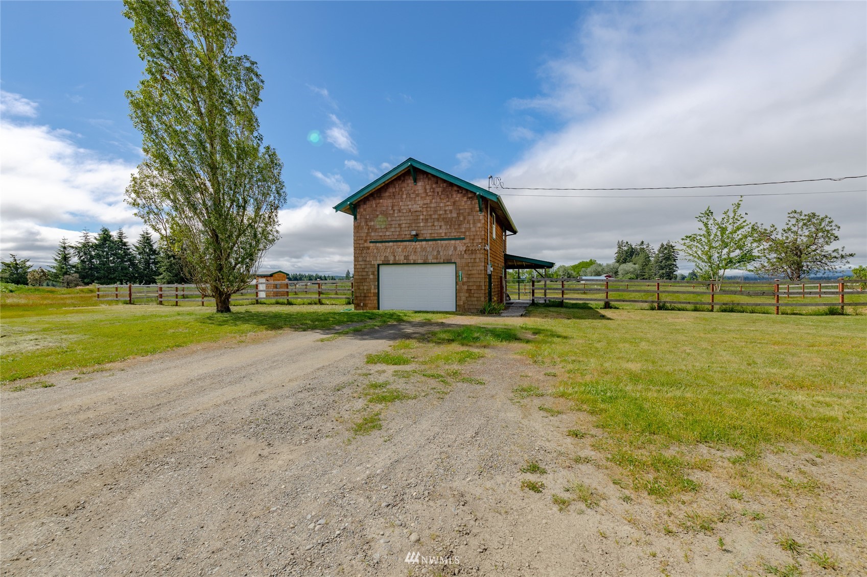 14202 Mima Road Southwest Olympia, WA 98512 - Photo 29 of 40 a front view of a house with a yard