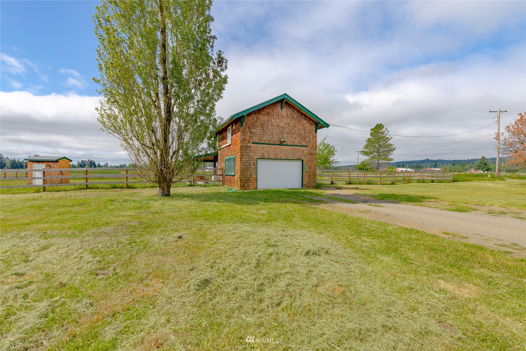 14202 Mima Road Southwest Olympia, WA 98512 - Photo 5 of 40 a front view of house with yard and ocean