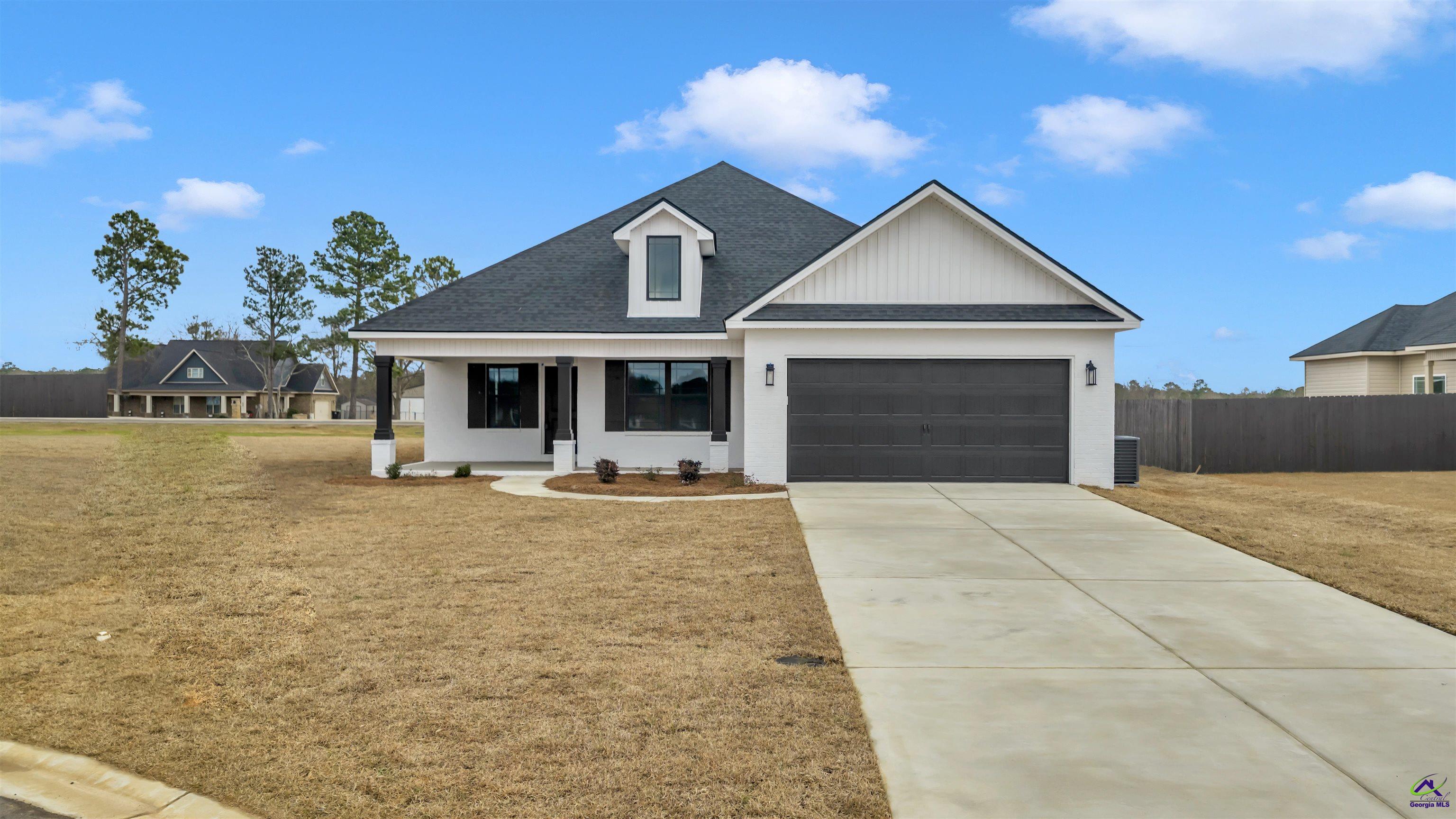 103 Early Drive Byron, GA 31008 - Photo 3 of 56 a front view of a house with yard and porch