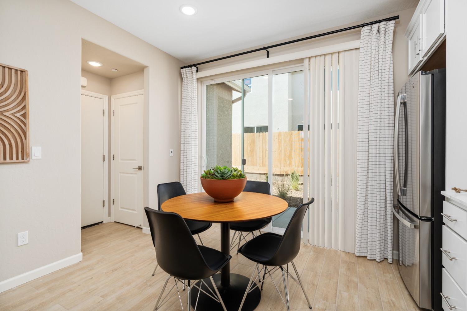 1116 Elevations Way West Madera, CA 93636 - Photo 11 of 20 a dining room with furniture and window