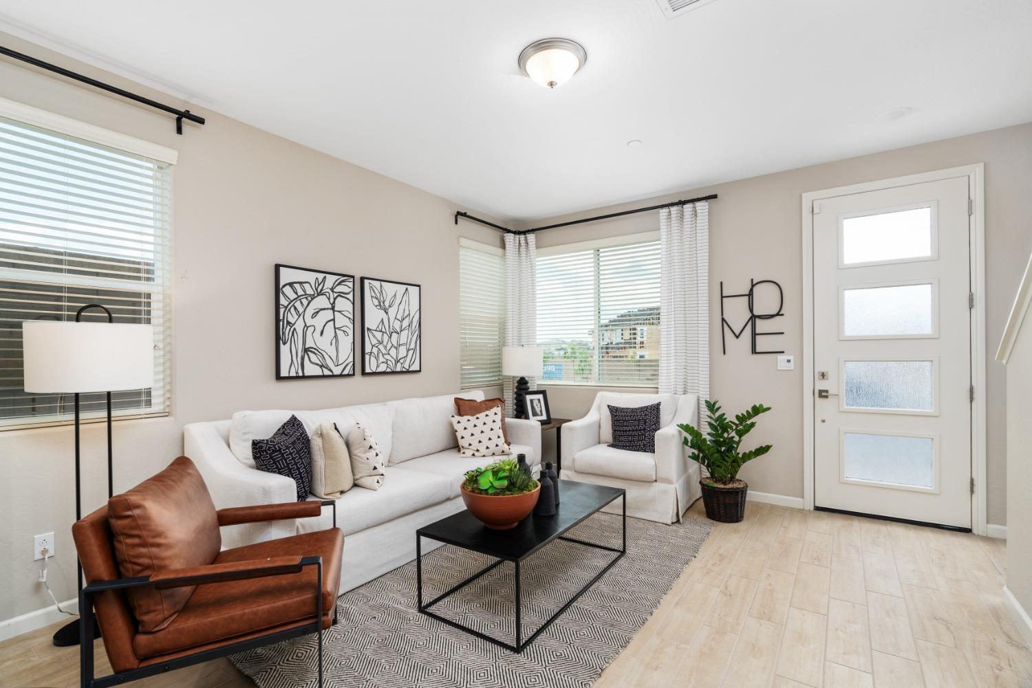 1116 Elevations Way West Madera, CA 93636 - Photo 3 of 20 a living room with furniture potted plant and window