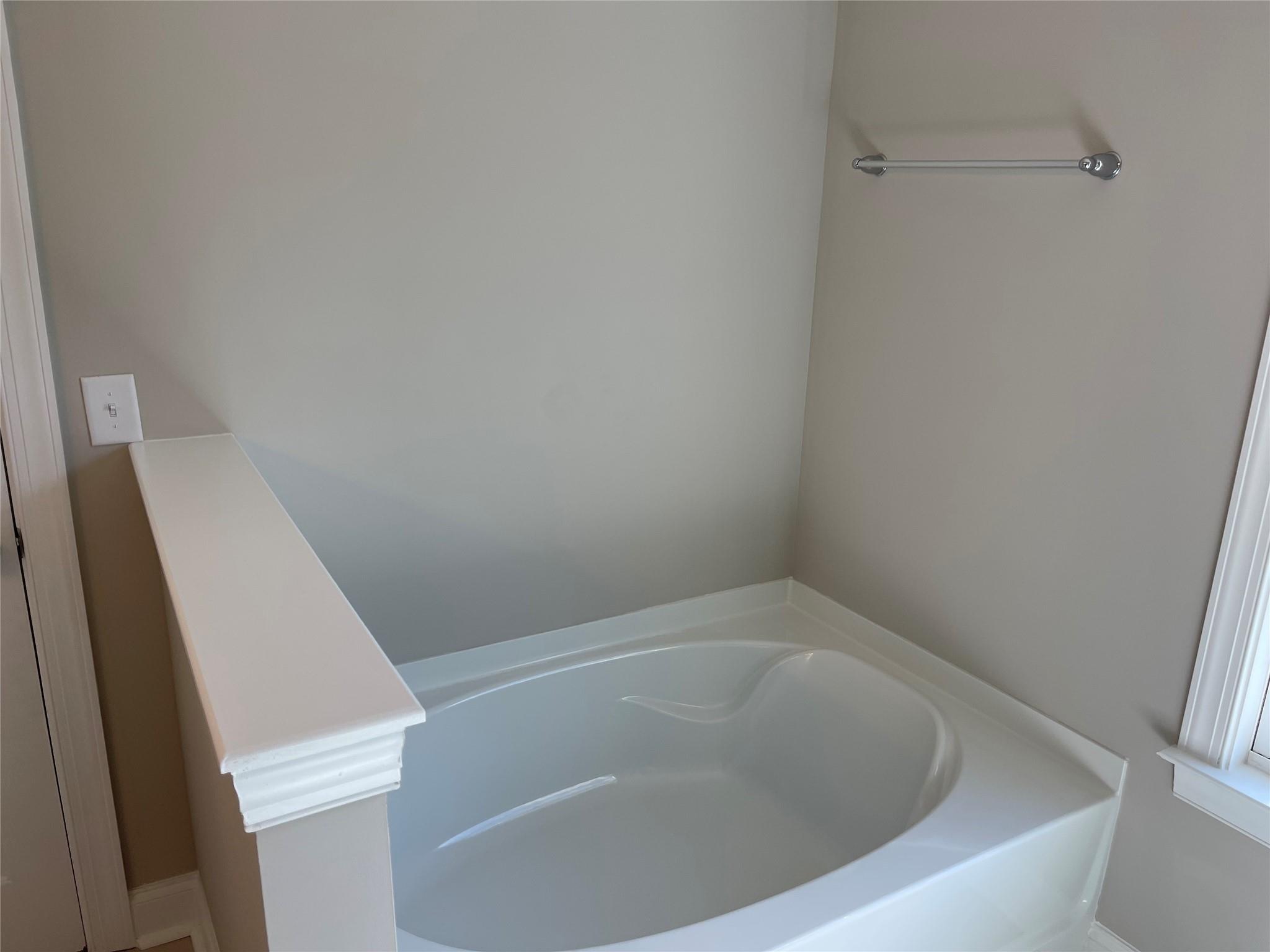 639 Church Street, Unit 99 Locust, NC 28097 - Photo 8 of 11 a view of a bathtub in a bathroom