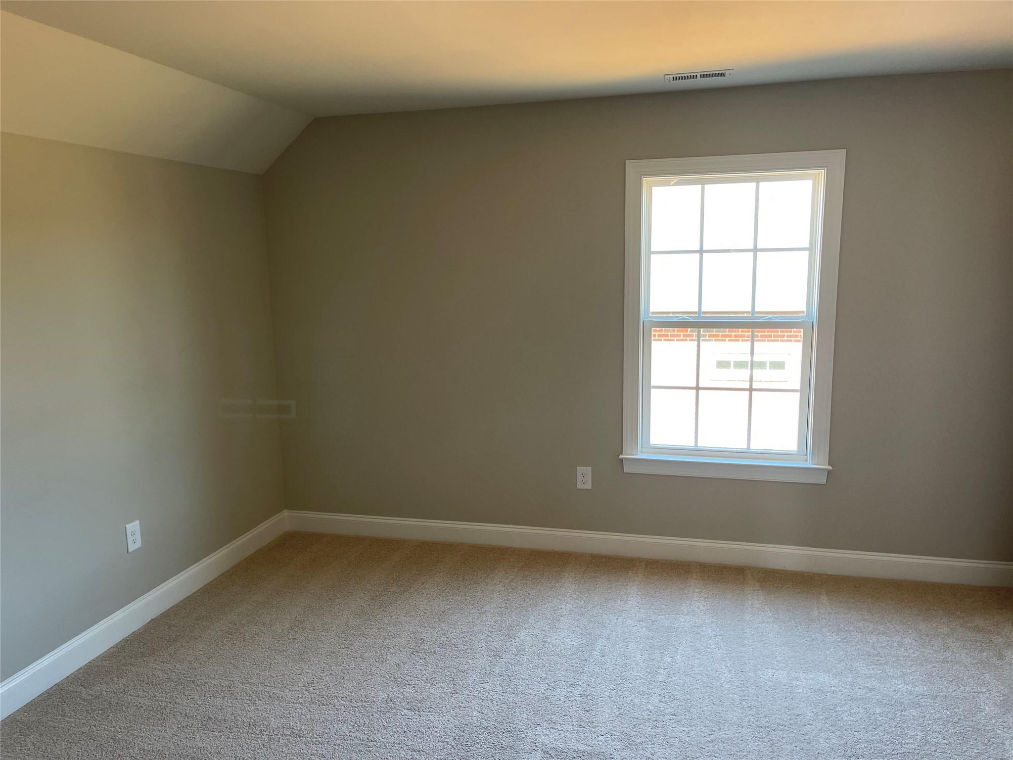 639 Church Street, Unit 99 Locust, NC 28097 - Photo 9 of 11 an empty room with a window