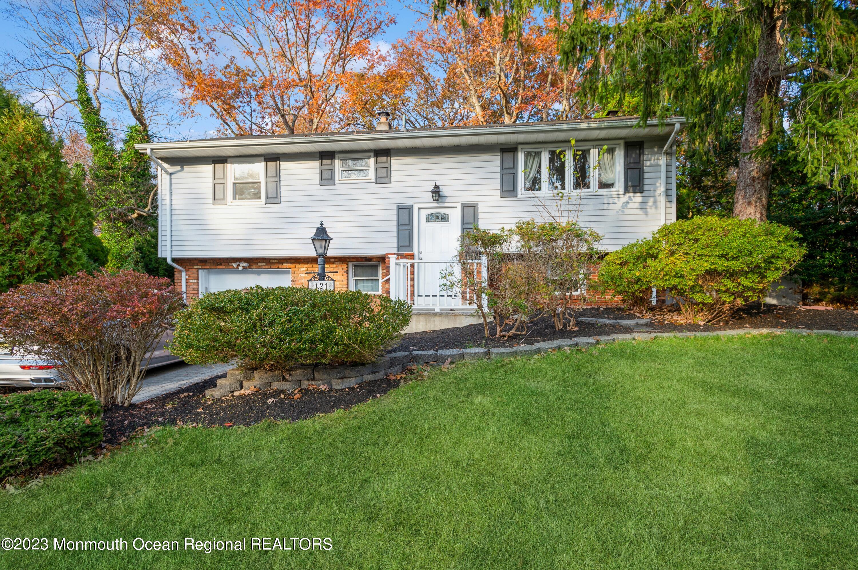 121 Darien Road Howell, NJ 07731 - Photo 1 of 19 a front view of house with yard and green space