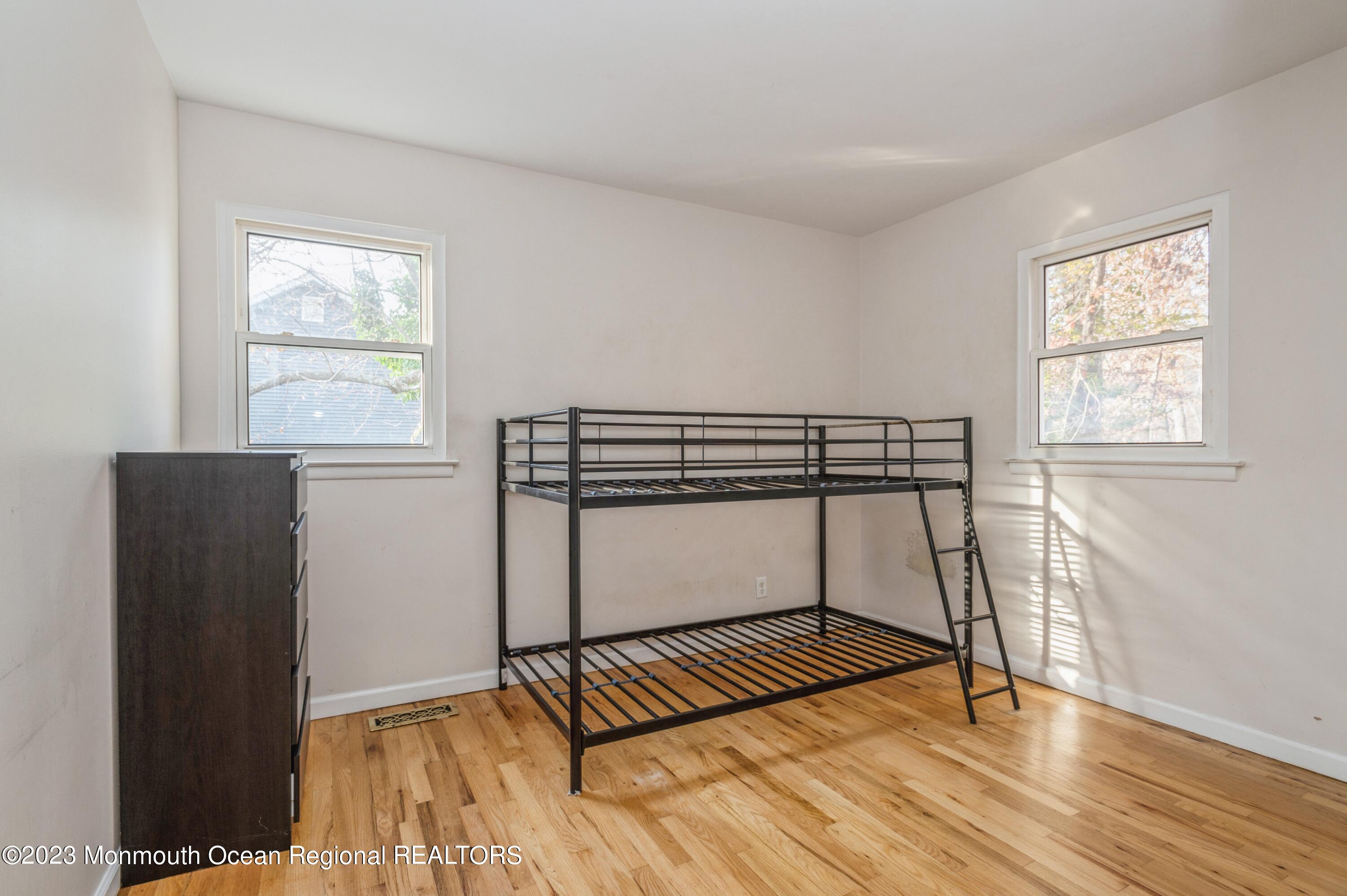 121 Darien Road Howell, NJ 07731 - Photo 11 of 19 a view of a room with wooden floor and windows