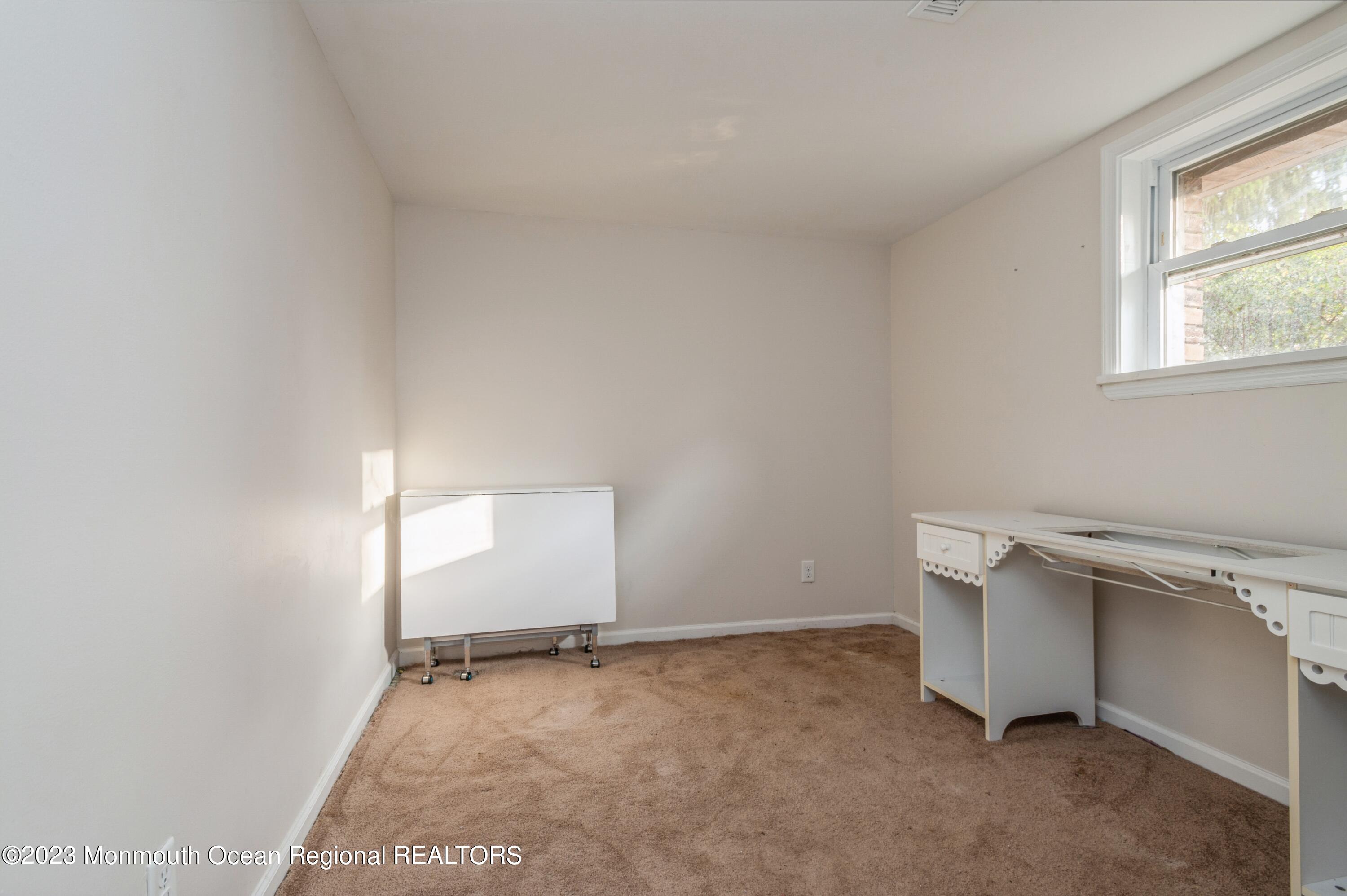 121 Darien Road Howell, NJ 07731 - Photo 14 of 19 an empty room with windows