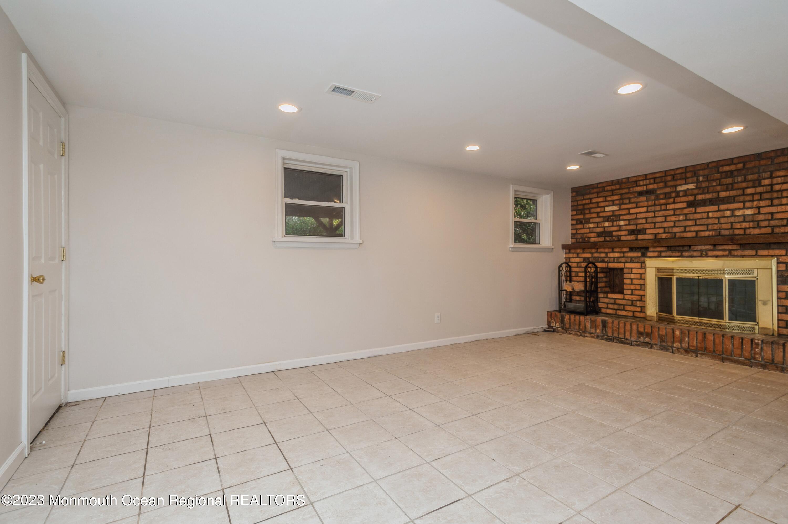 121 Darien Road Howell, NJ 07731 - Photo 15 of 19 an empty room with windows