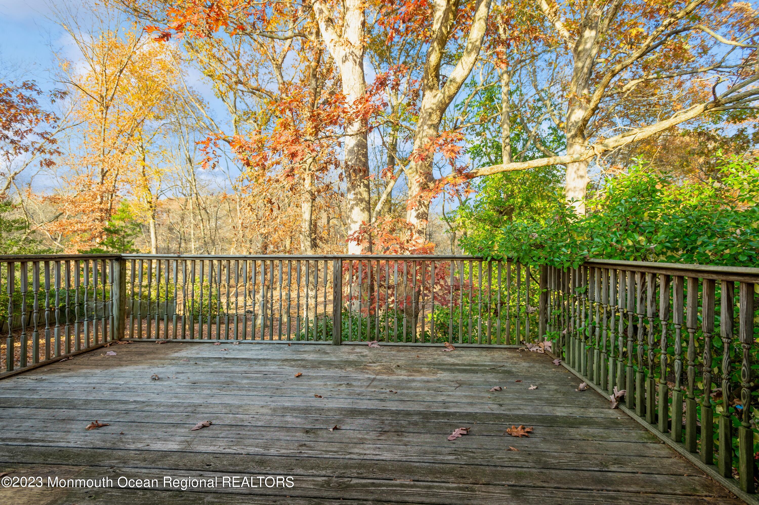 121 Darien Road Howell, NJ 07731 - Photo 18 of 19 a balcony with trees in front of it