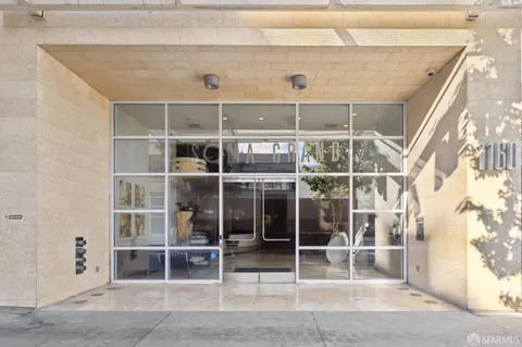 a view of a room with wooden shelves