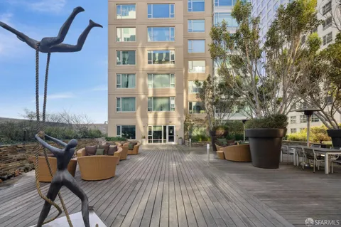 a view of a patio with couches chairs and potted plants