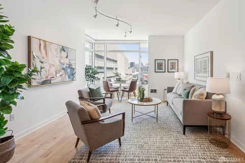 a living room with furniture and a table