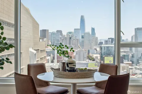 a view of a dining room with furniture window and outside view