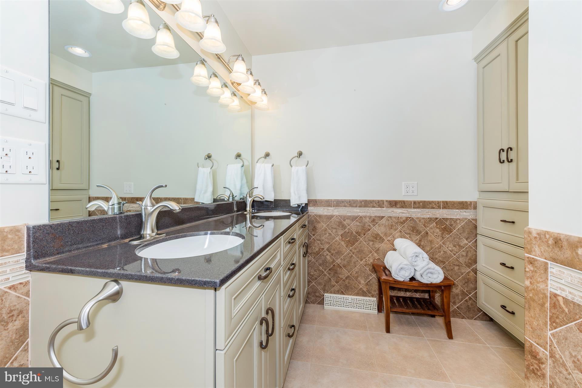 10823 Shanktown Road Big Pool, MD 21711 - Photo 21 of 30 a bathroom with a granite countertop sink a mirror and a bathtub