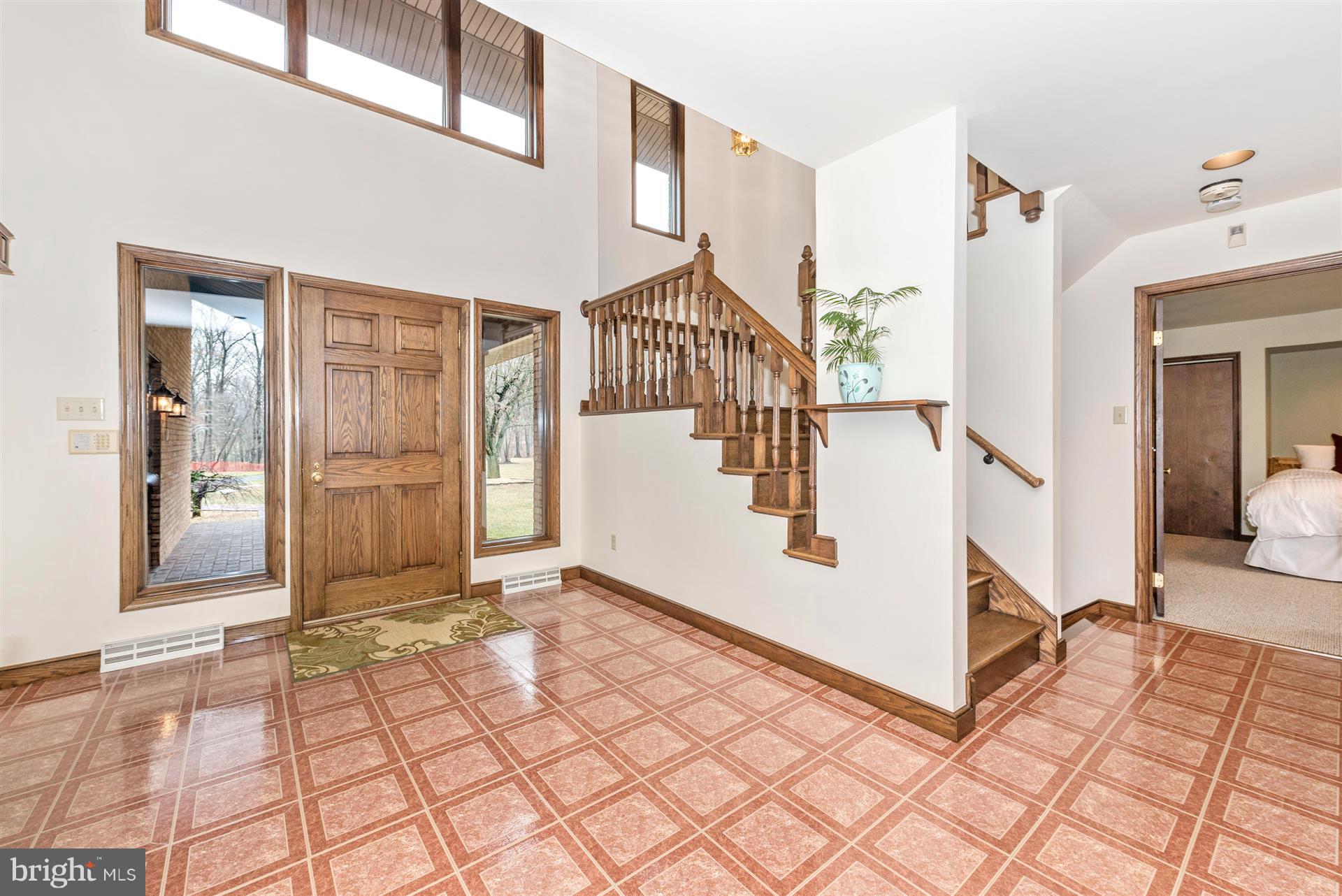 10823 Shanktown Road Big Pool, MD 21711 - Photo 10 of 30 a view of a livingroom with wooden floor and stairs