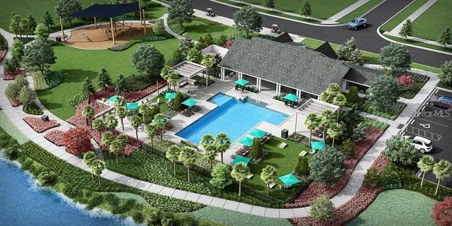 an aerial view of a house with a yard and outdoor seating