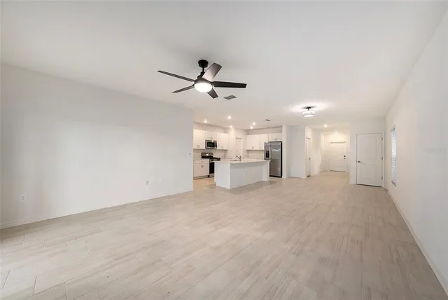 a view of a livingroom with a ceiling fan