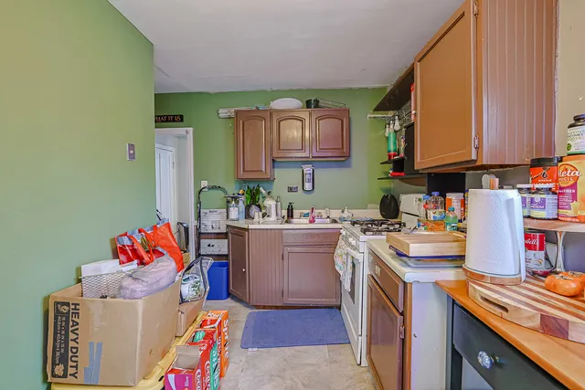 a living room with furniture and a book shelf