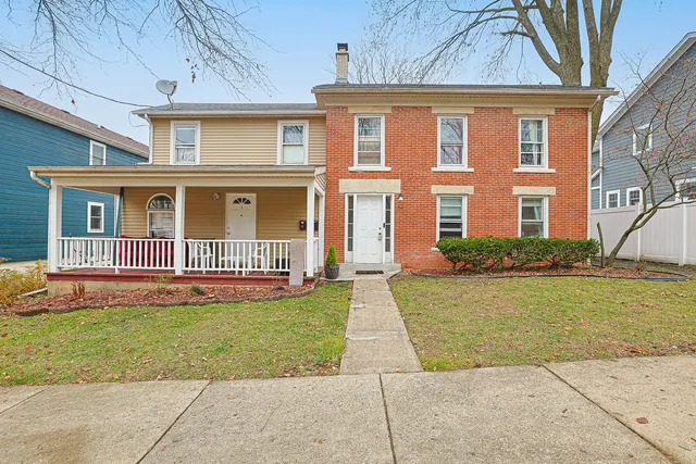 front view of a house with a yard