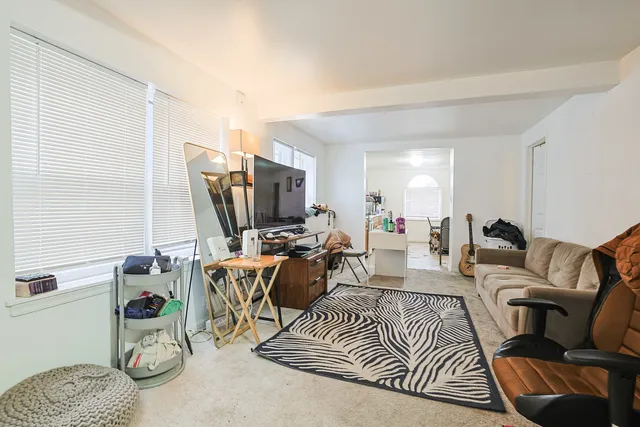 a view of a patio with iron fence