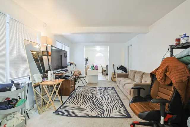 a view of a house with backyard and porch
