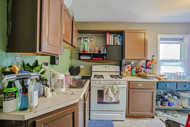 a view of a livingroom with wooden floor and a couch