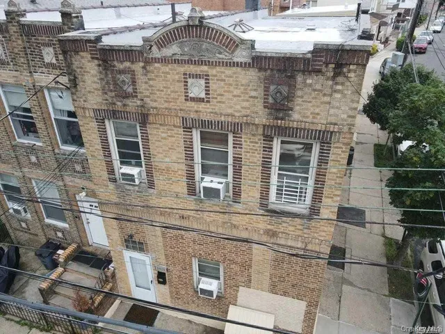 a front view of a building with glass windows
