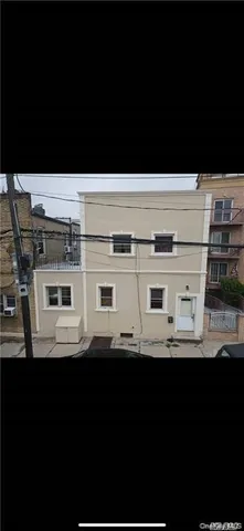 a black and white photo of a black and white kitchen