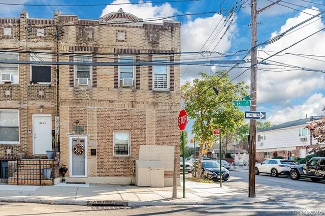 a front view of a building with street view