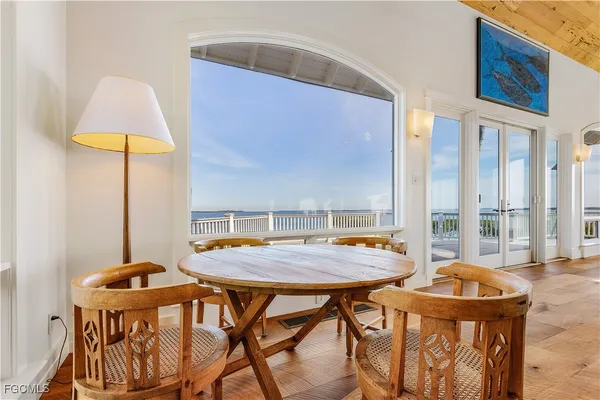 a view of a dining room with furniture and a chandelier