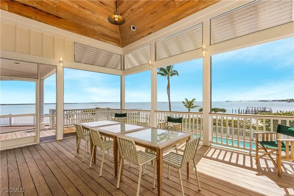 a view of a balcony with wooden floor