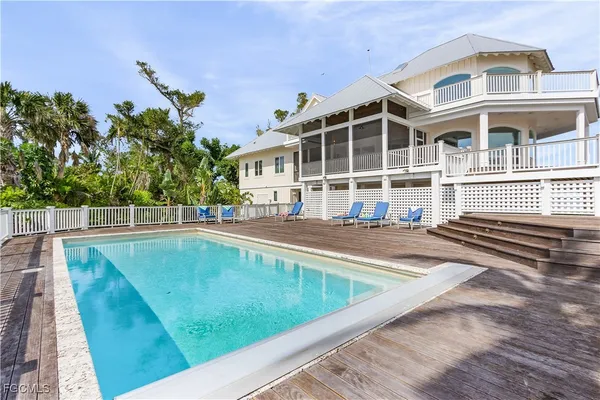a view of a swimming pool with a lounge chairs