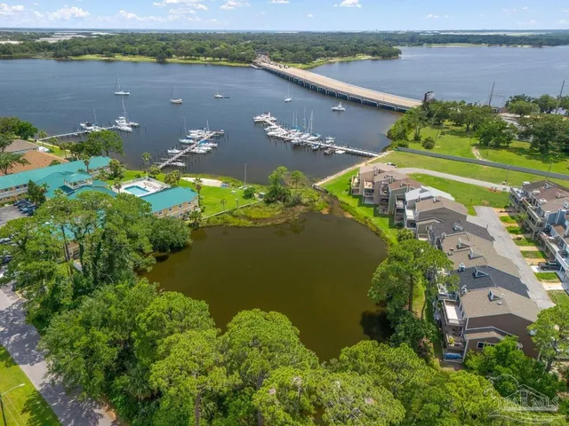 an aerial view of a houses with lake view