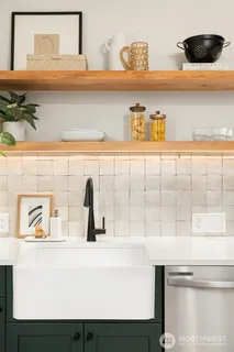 a close view of sink and cabinets