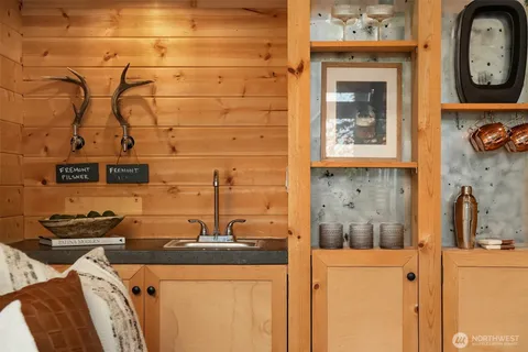 a view of a chair and table in the garden