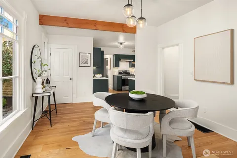 a dining room with furniture and a chandelier