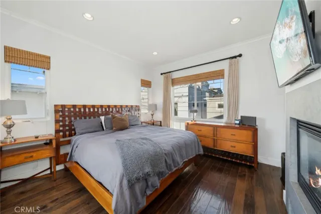 a bathroom with a granite countertop sink a large mirror and a bathtub