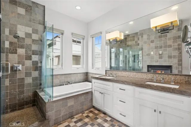 a bedroom with a bed and a large mirror