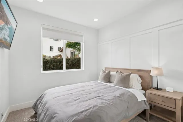 a bathroom with a granite countertop sink a toilet and a shower
