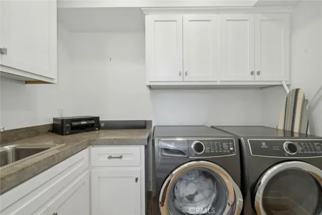a white toilet sitting next to a bathroom sink