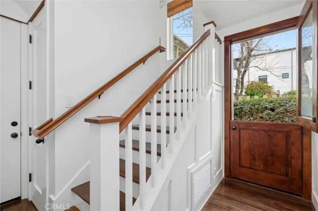 a living room with furniture fireplace and flat screen tv