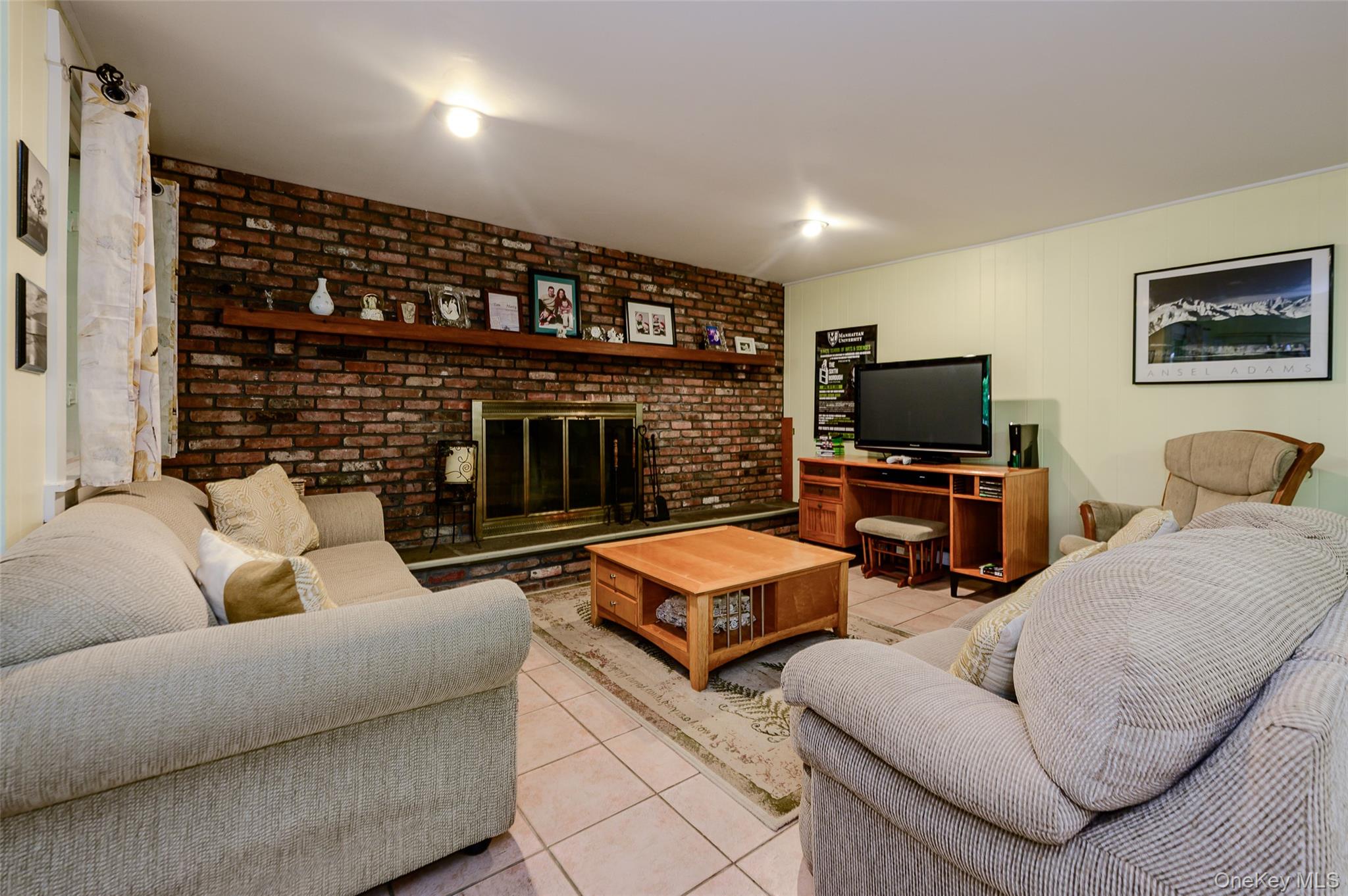 231 Increase Miller Road Katonah, NY 10536 - Photo 20 of 34 Lower-level family room with wood-burning fireplace.