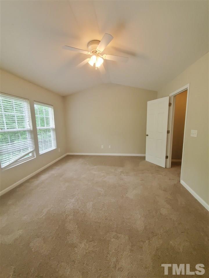 8208 Clasara Circle Raleigh, NC 27613 - Photo 12 of 26 an empty room with windows and entrance