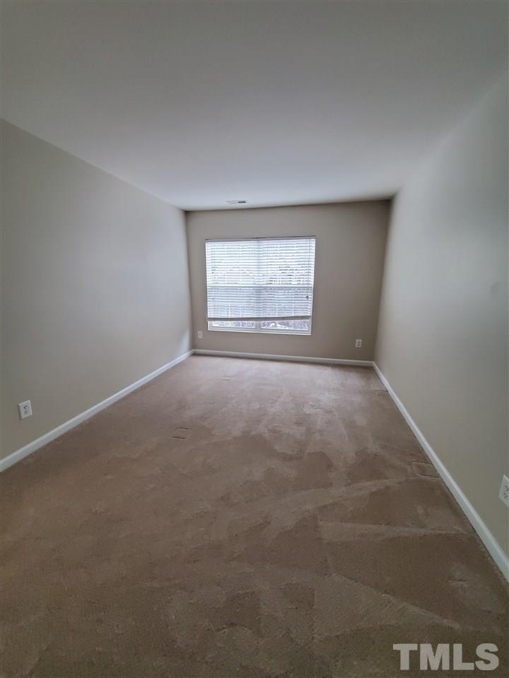 8208 Clasara Circle Raleigh, NC 27613 - Photo 16 of 26 an empty room with a window