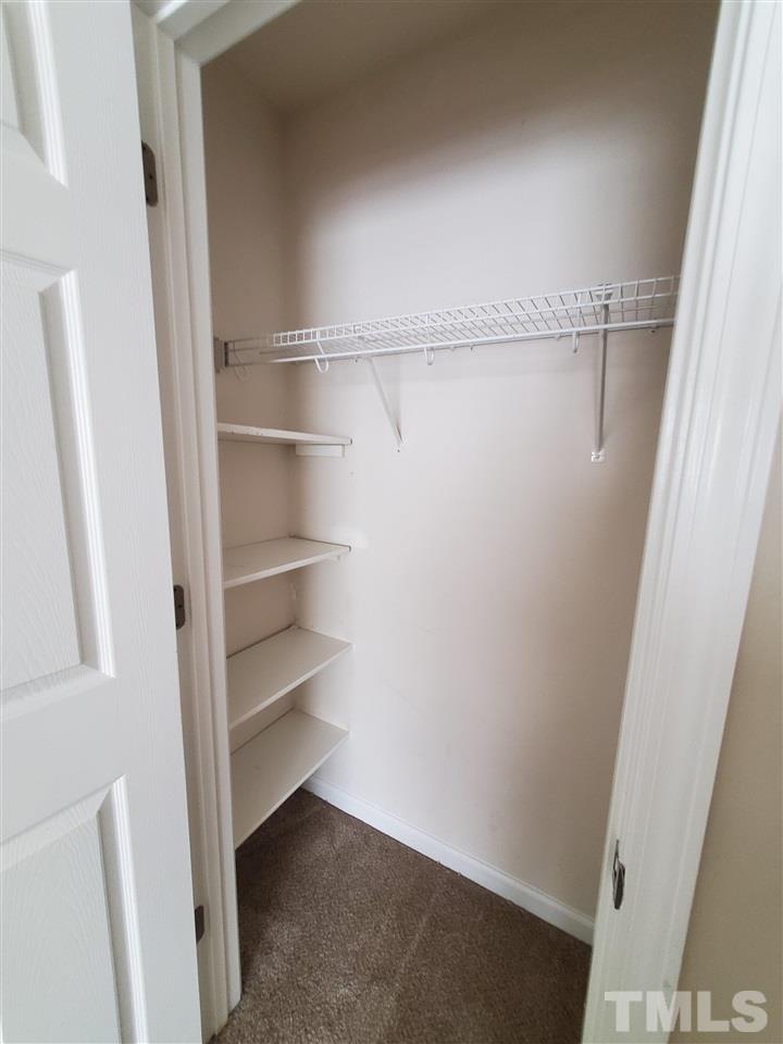 8208 Clasara Circle Raleigh, NC 27613 - Photo 17 of 26 a view of an empty walk in closet