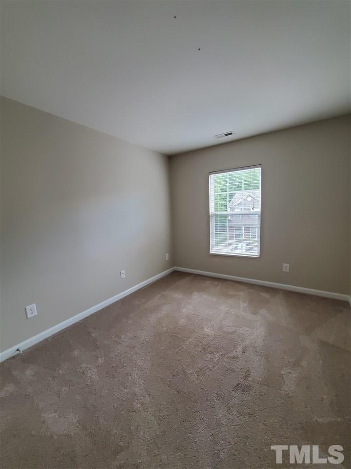 8208 Clasara Circle Raleigh, NC 27613 - Photo 18 of 26 an empty room with a window